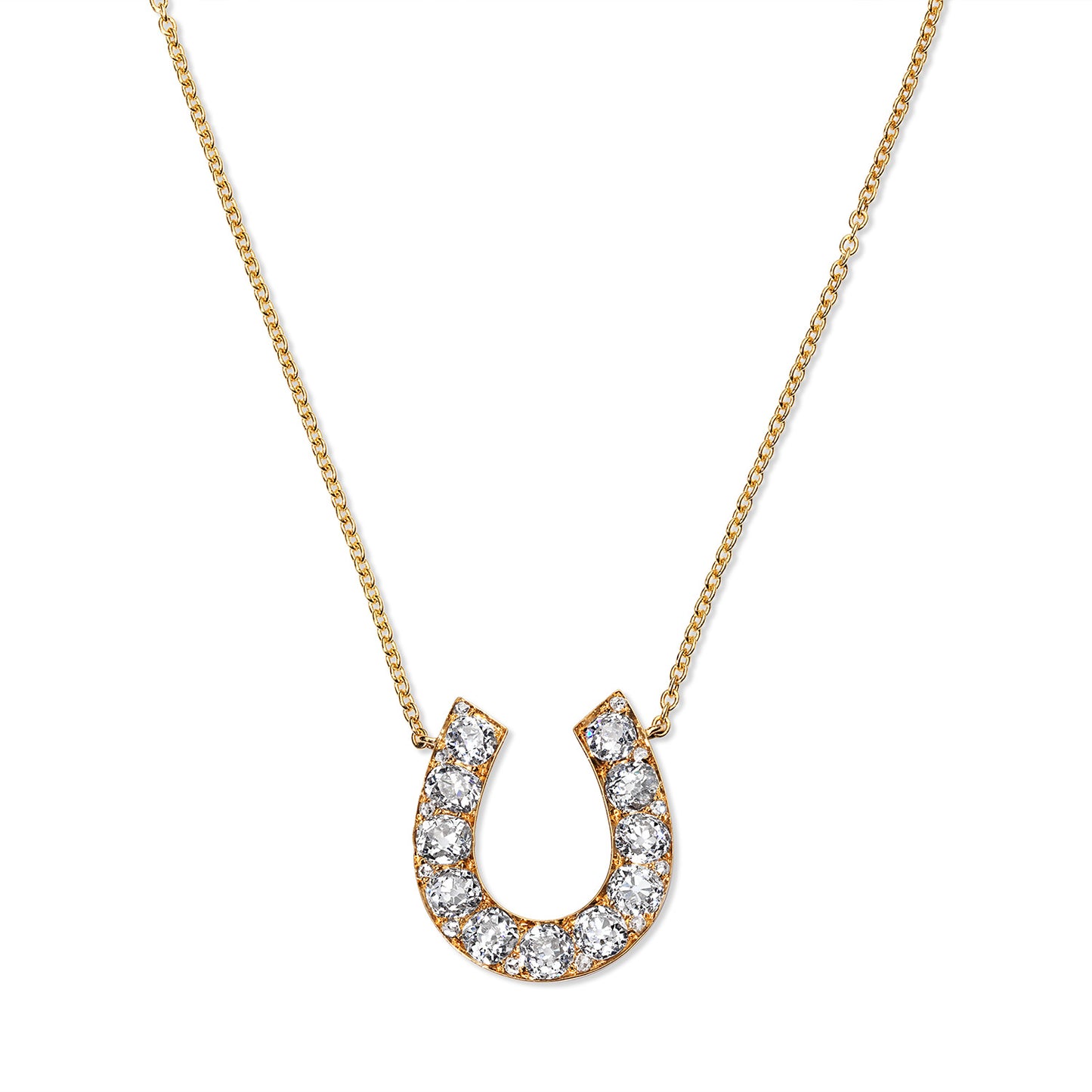Unique 18 karat yellow gold antique horseshoe pendant, curated by Susan L. Kottemann in New York. Features eleven .25 carat miner cut diamonds, originally a brooch transformed into a stunning pendant, perfect for any collection
