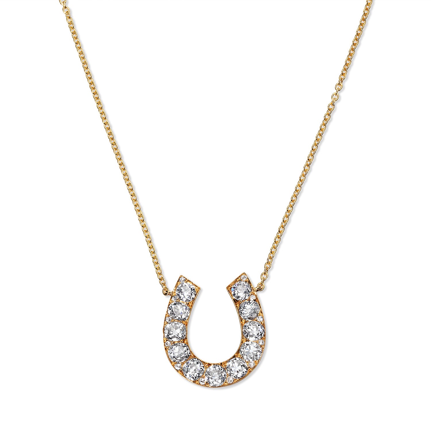 Unique 18 karat yellow gold antique horseshoe pendant, curated by Susan L. Kottemann in New York. Features eleven .25 carat miner cut diamonds, originally a brooch transformed into a stunning pendant, perfect for any collection