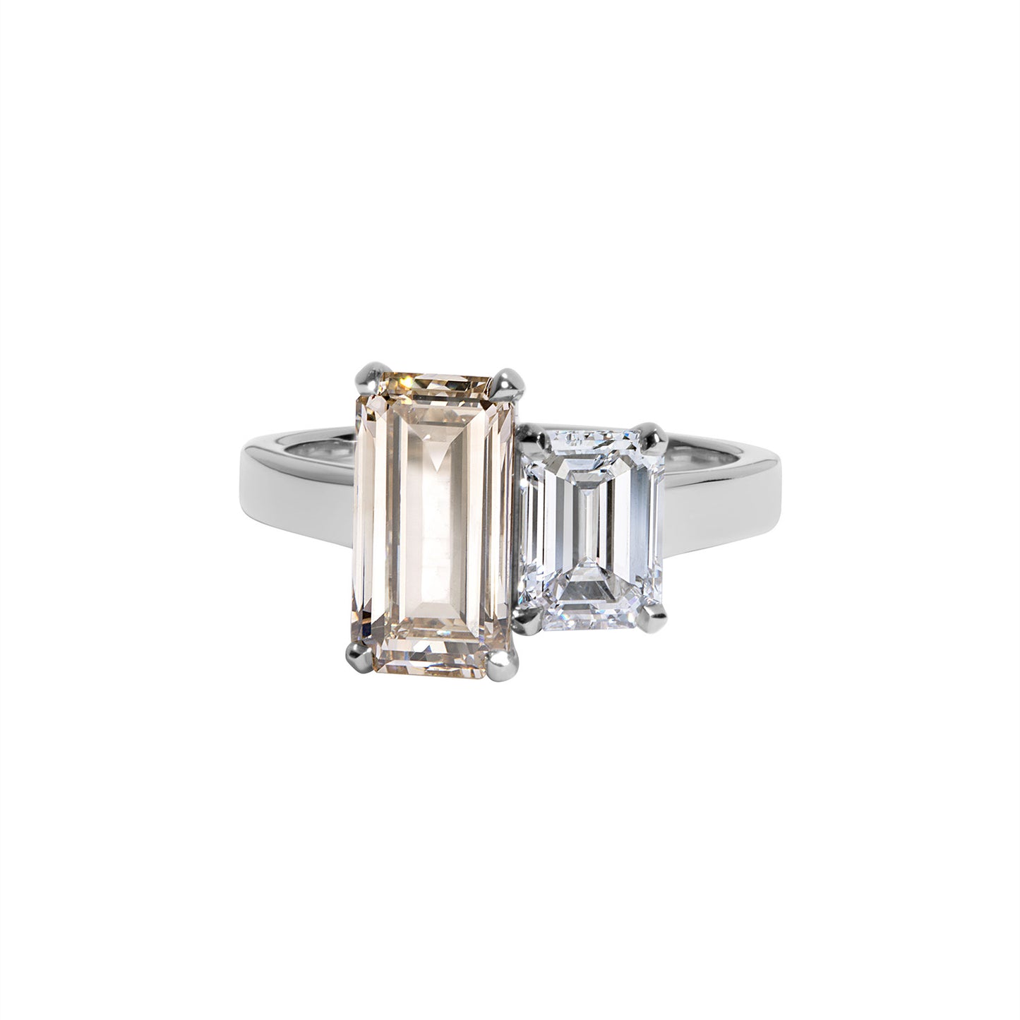 Emerald-cut diamond engagement ring featuring a central champagne diamond flanked by 1 white diamonds on a platinum band.