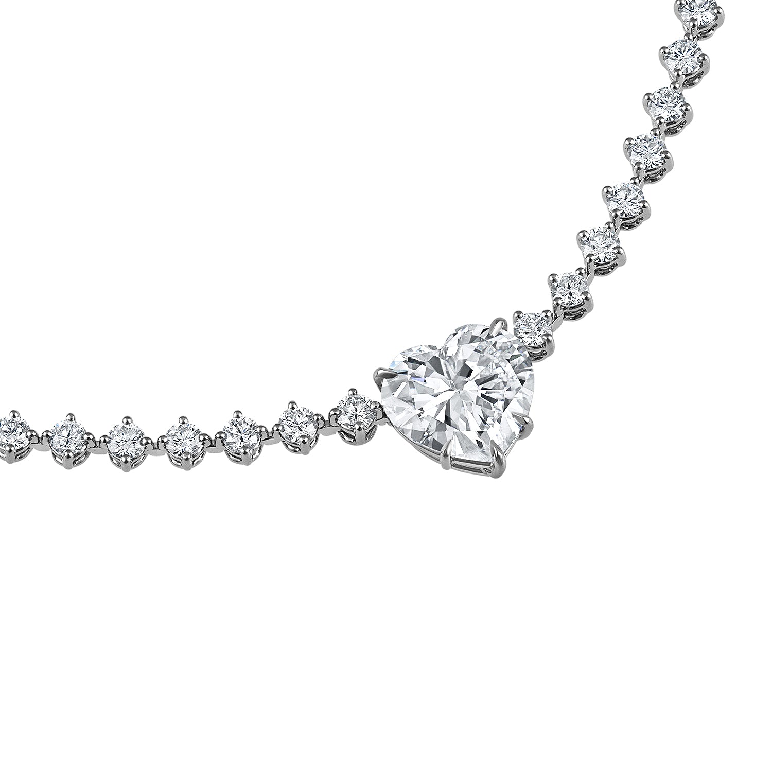 Side view of the platinum heart-shaped diamond necklace, showcasing the exquisite compass prong setting and the continuous riviera style diamond chain.